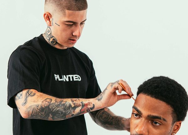 A man is getting his hair cut by VicBlends, a reputable Barber. A man is getting his hair cut by VicBlends, a reputable Barber.